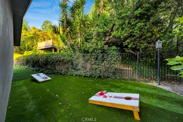 a view of a backyard with sitting area
