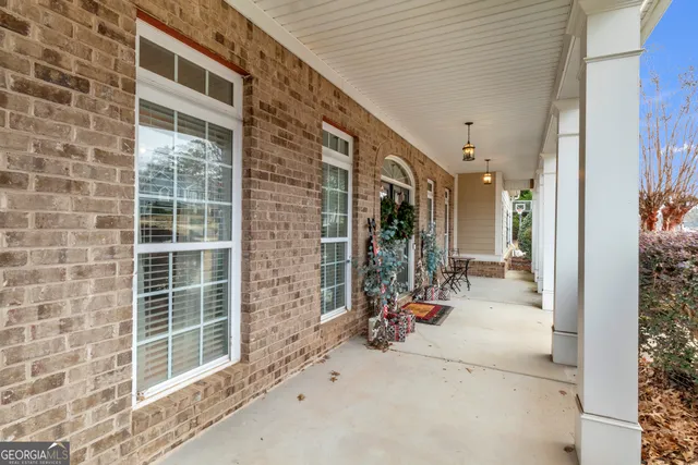 a living room with furniture and a clock