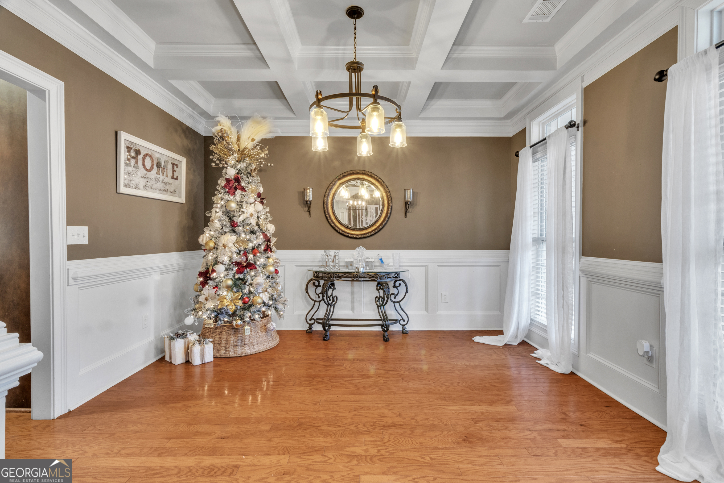 111 Caraway Road Locust Grove, GA 30248 - Photo 12 of 52 a living room with furniture and a clock