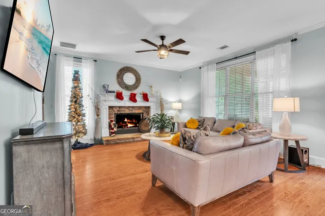 a living room with furniture and a flat screen tv