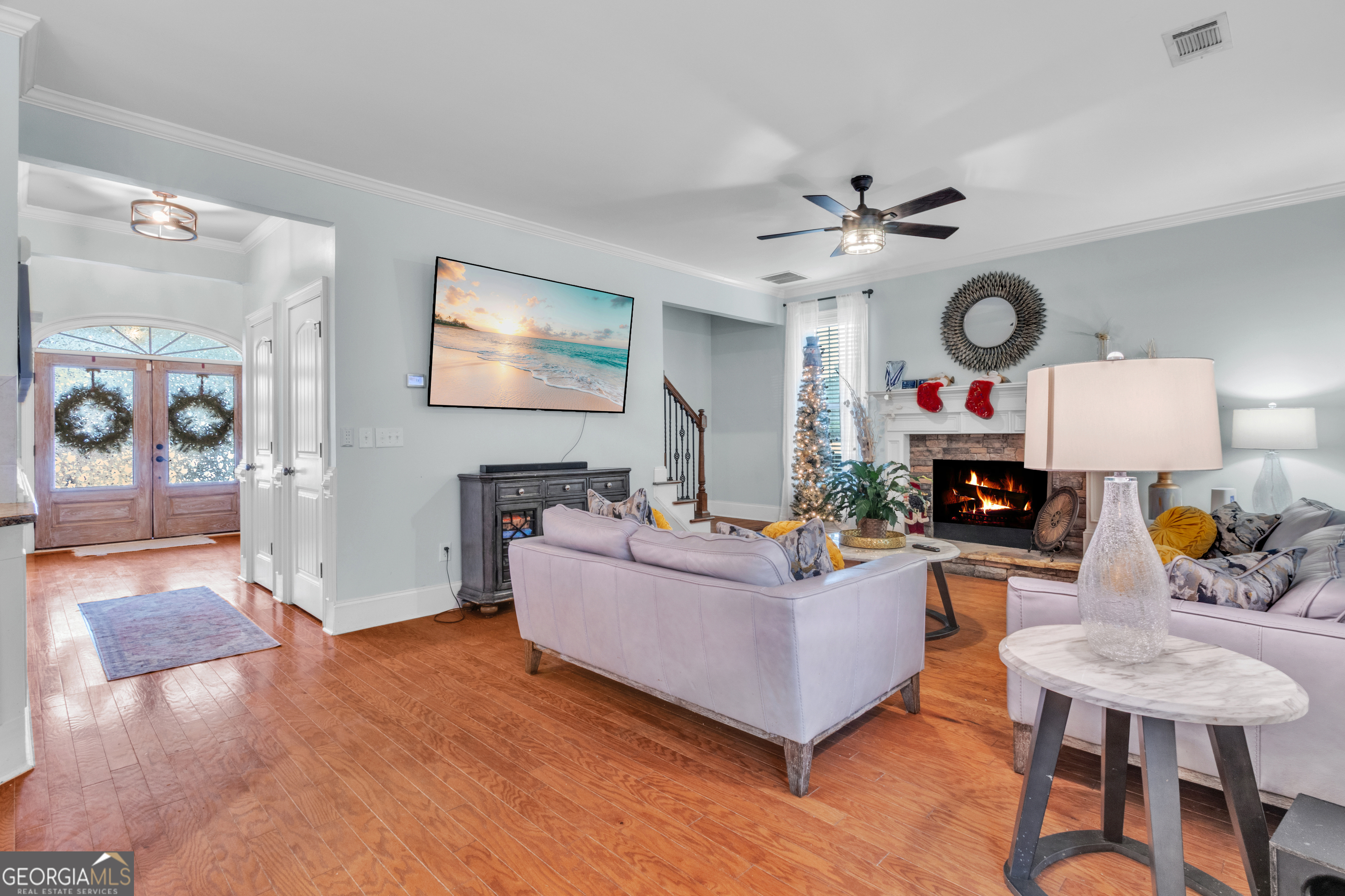 111 Caraway Road Locust Grove, GA 30248 - Photo 17 of 52 a living room with furniture and a flat screen tv