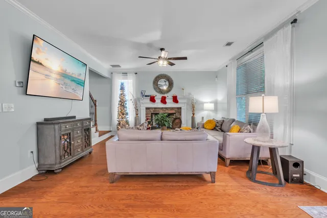 a living room with furniture and a flat screen tv