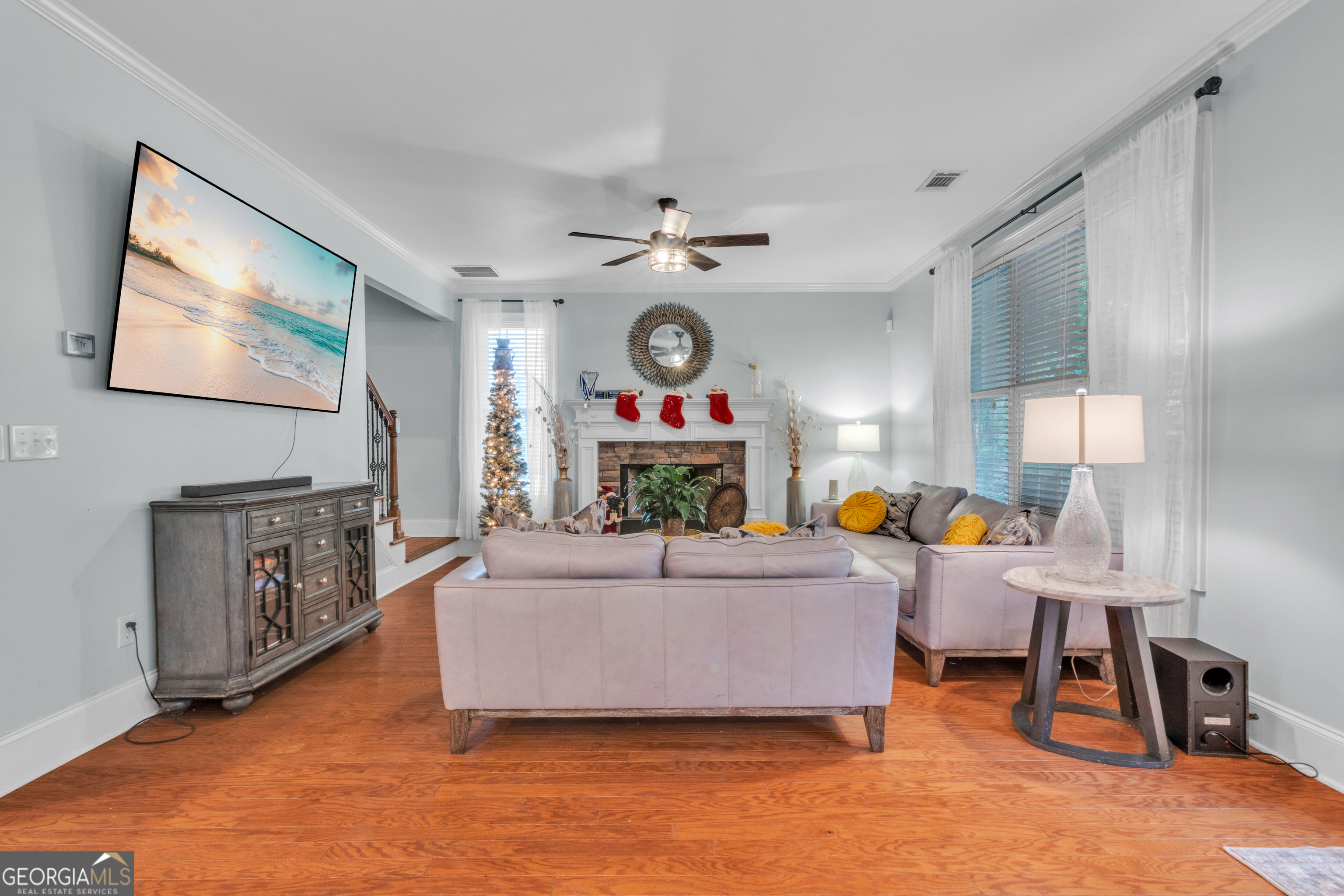 111 Caraway Road Locust Grove, GA 30248 - Photo 18 of 52 a living room with furniture and a flat screen tv