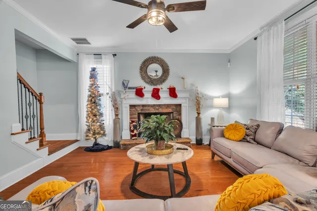 a kitchen with stainless steel appliances granite countertop a sink refrigerator and cabinets