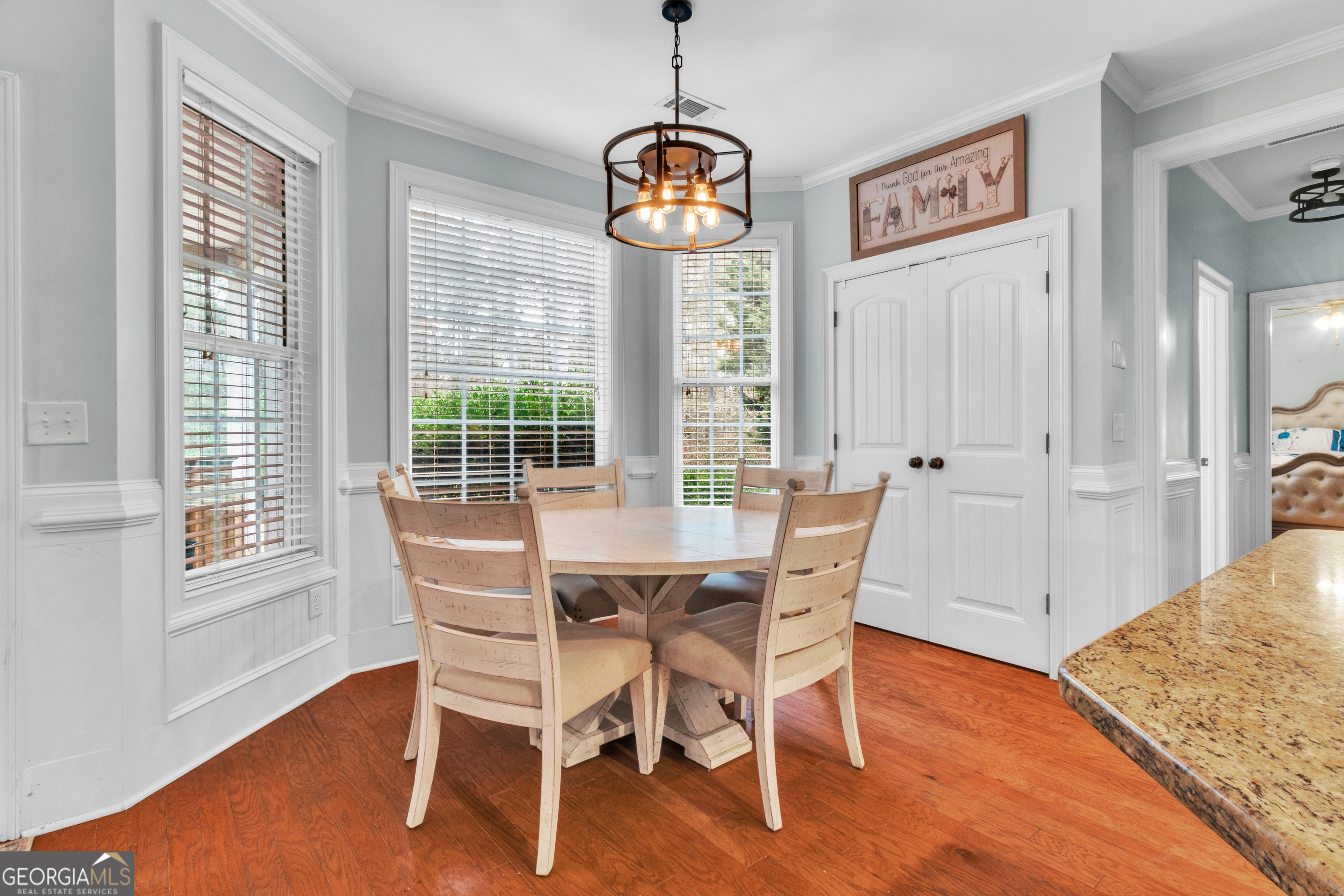 111 Caraway Road Locust Grove, GA 30248 - Photo 22 of 52 a dining room with furniture wooden floor and a rug