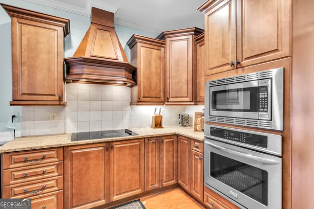 a kitchen with a sink cabinets and chandelier