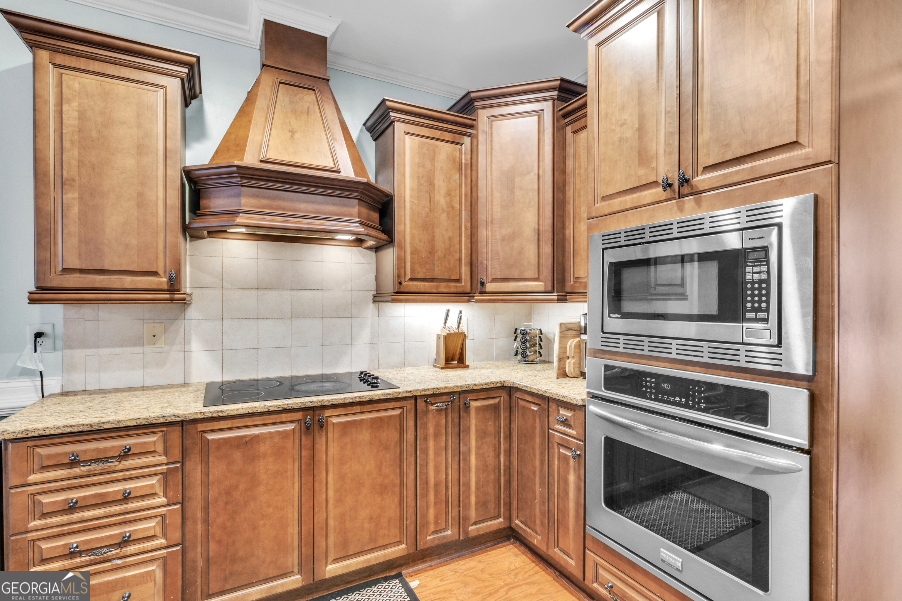 111 Caraway Road Locust Grove, GA 30248 - Photo 25 of 52 a kitchen with granite countertop cabinets stainless steel appliances and a sink
