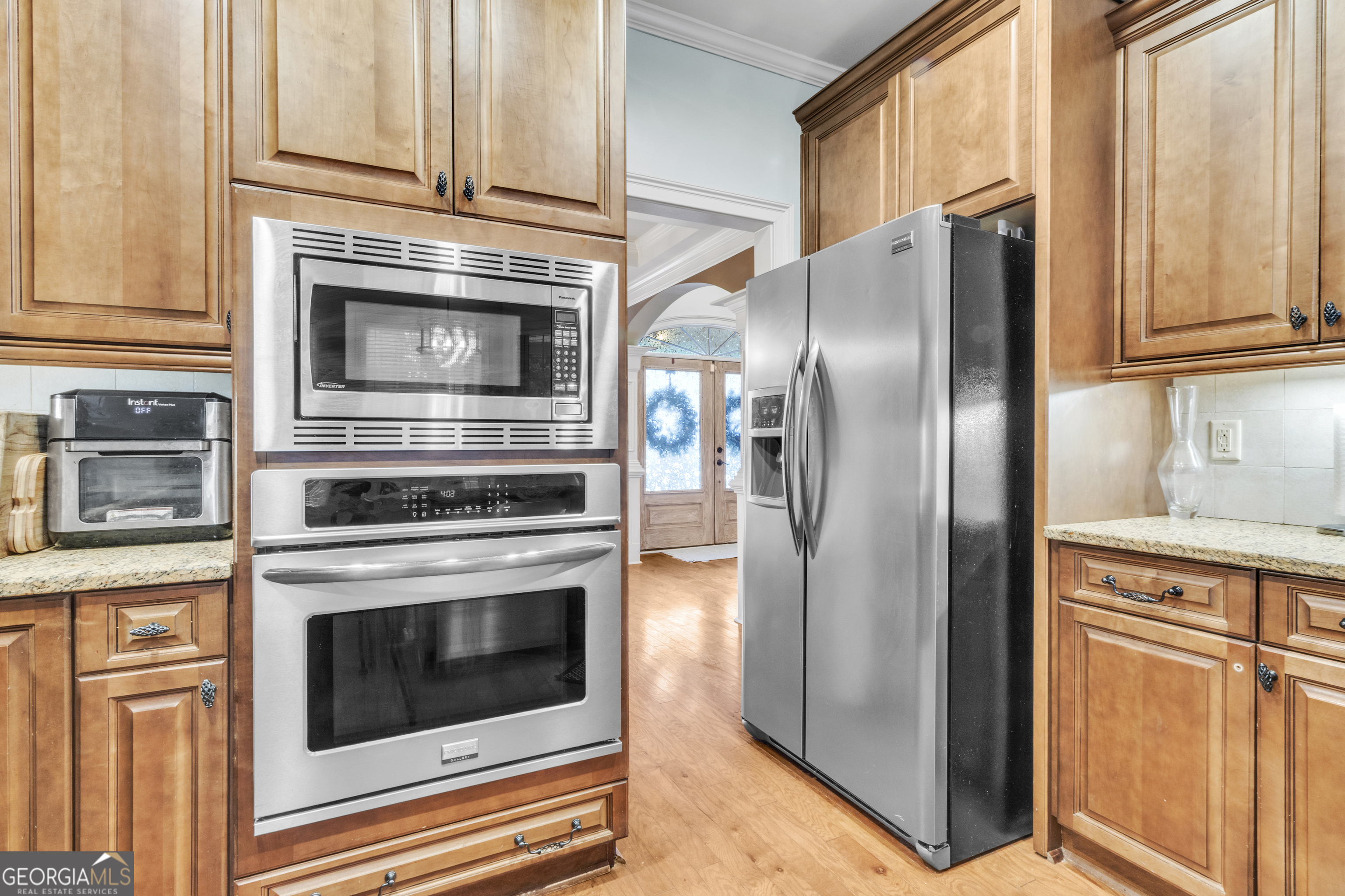 111 Caraway Road Locust Grove, GA 30248 - Photo 26 of 52 a kitchen with cabinets stainless steel appliances and a window
