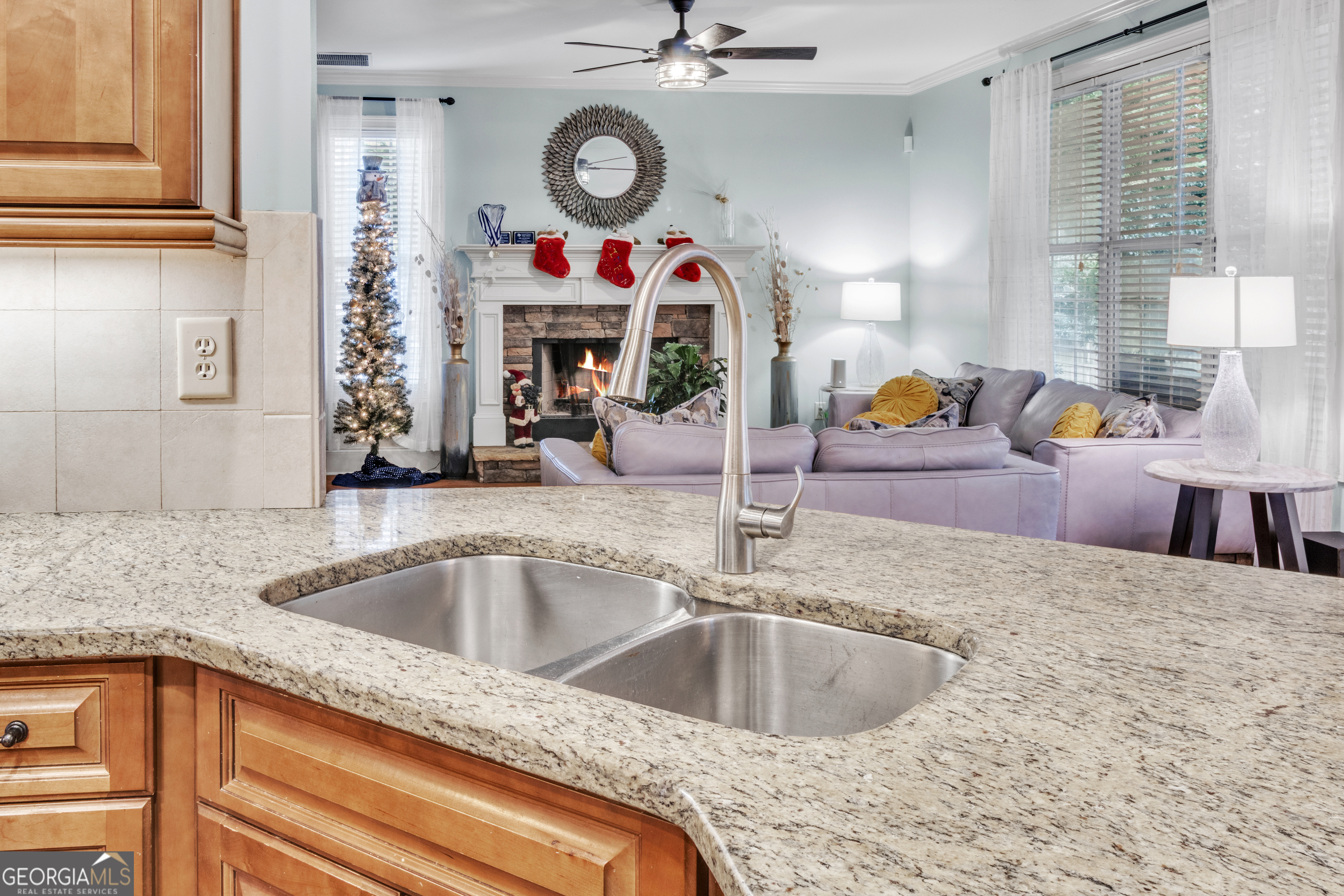 111 Caraway Road Locust Grove, GA 30248 - Photo 27 of 52 a kitchen with a sink cabinets and chandelier