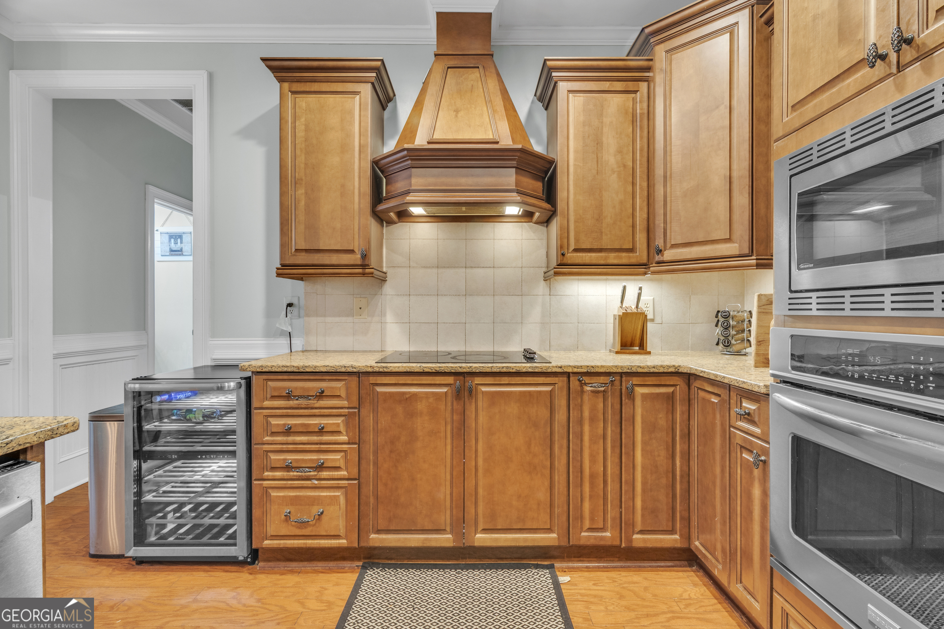 111 Caraway Road Locust Grove, GA 30248 - Photo 28 of 52 a kitchen with granite countertop a sink and cabinets