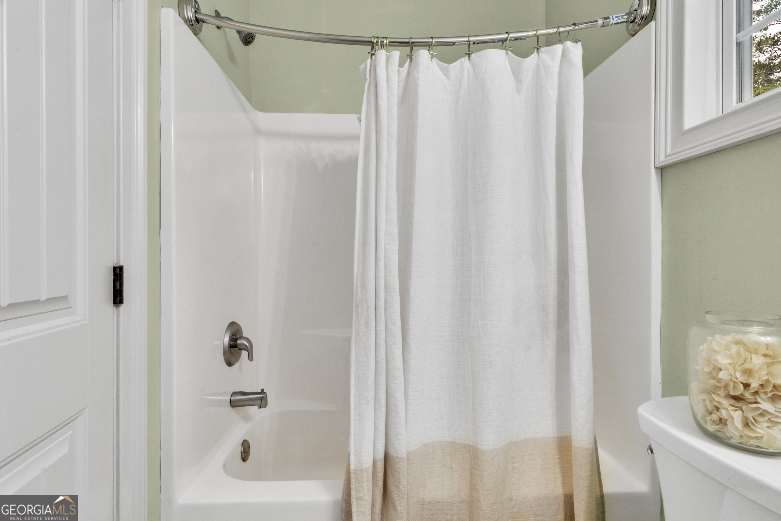 111 Caraway Road Locust Grove, GA 30248 - Photo 30 of 52 a bathroom with a shower and a tub