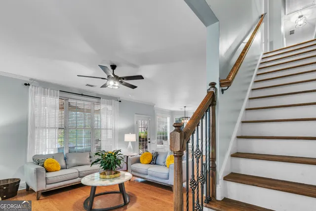 a spacious bedroom with a bed and a chandelier