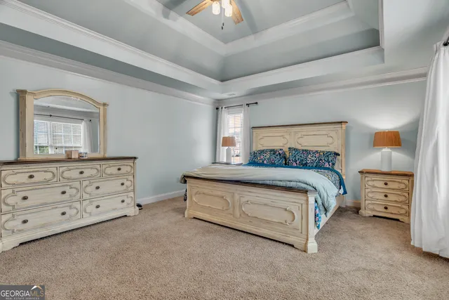 a view of walk in closet with clothes