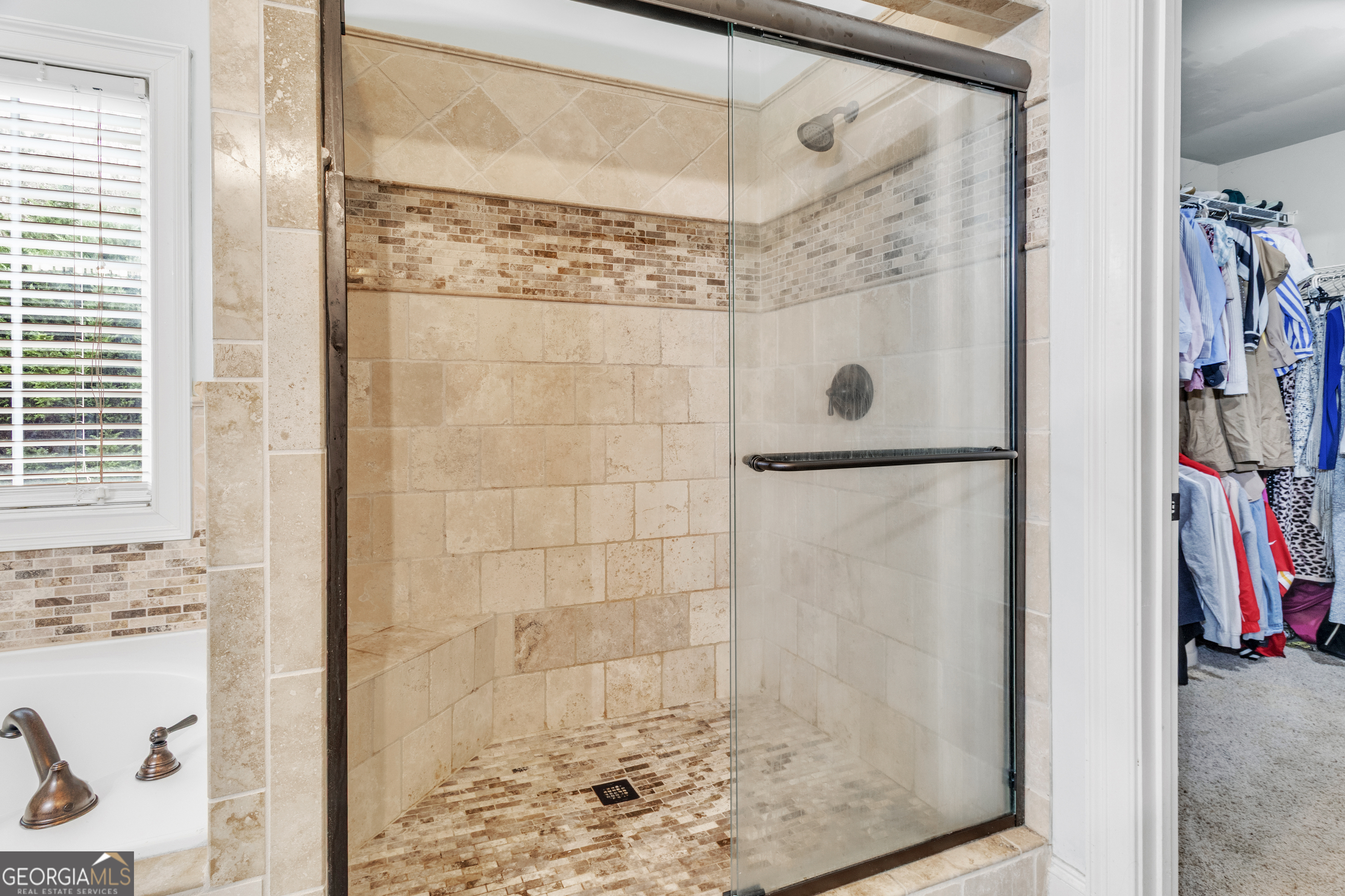 111 Caraway Road Locust Grove, GA 30248 - Photo 38 of 52 a bathroom with a shower