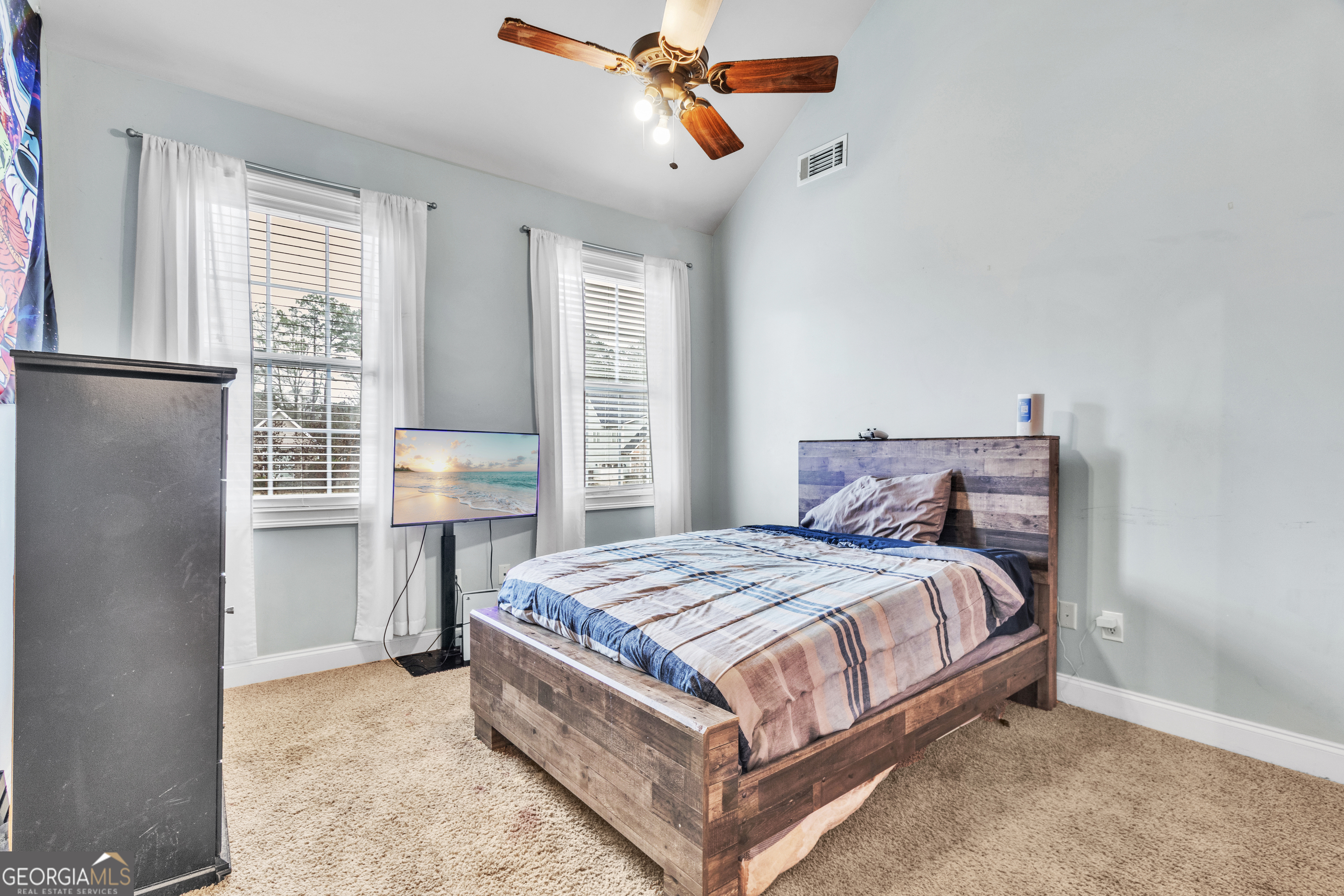111 Caraway Road Locust Grove, GA 30248 - Photo 42 of 52 a bedroom with a bed and window