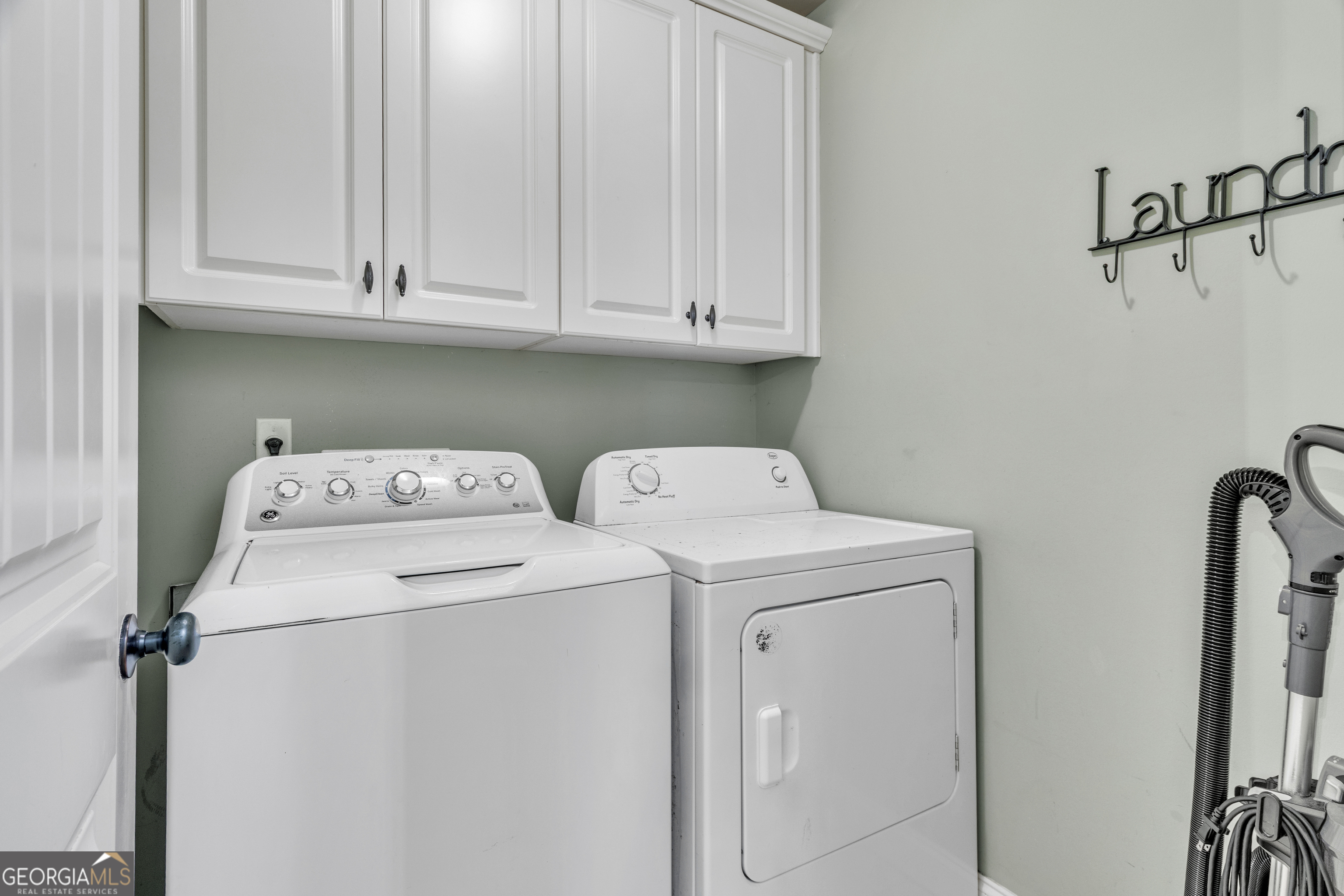 111 Caraway Road Locust Grove, GA 30248 - Photo 43 of 52 a utility room with dryer and washer
