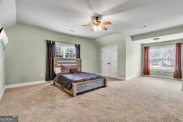 a view of a livingroom with kitchen and furniture