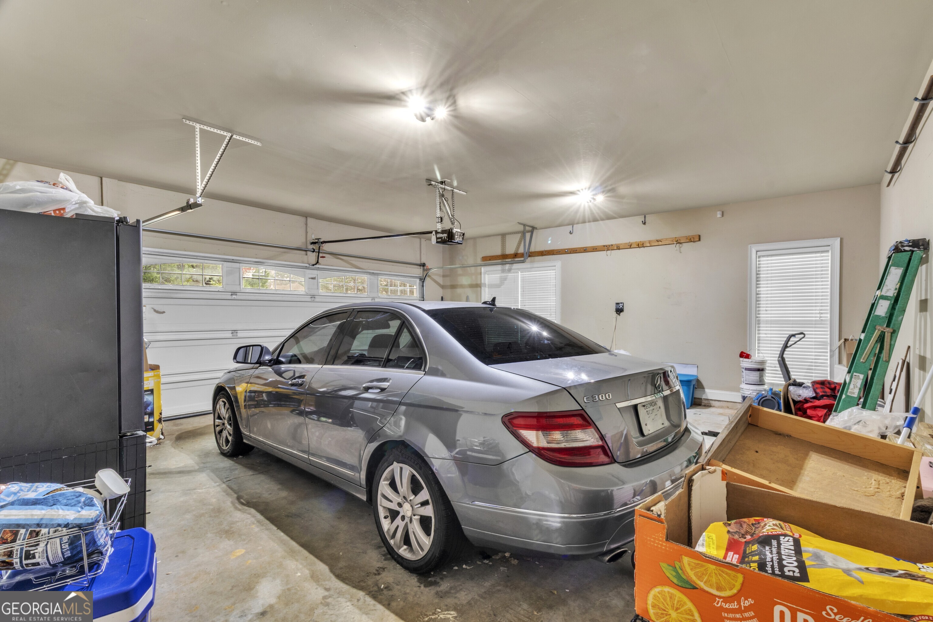 111 Caraway Road Locust Grove, GA 30248 - Photo 47 of 52 a car and bike parked in a garage