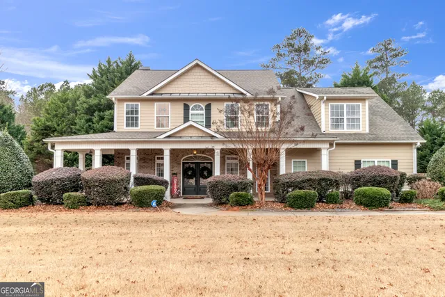 a front view of a house with a yard