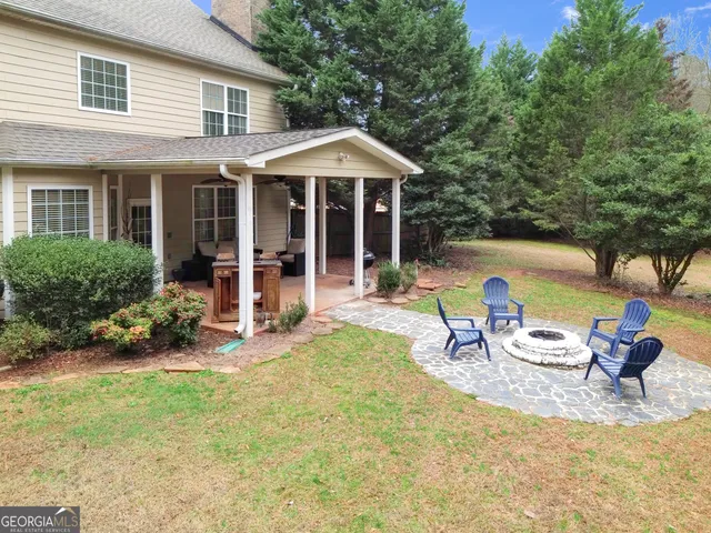 an aerial view of a house with a yard and a garden