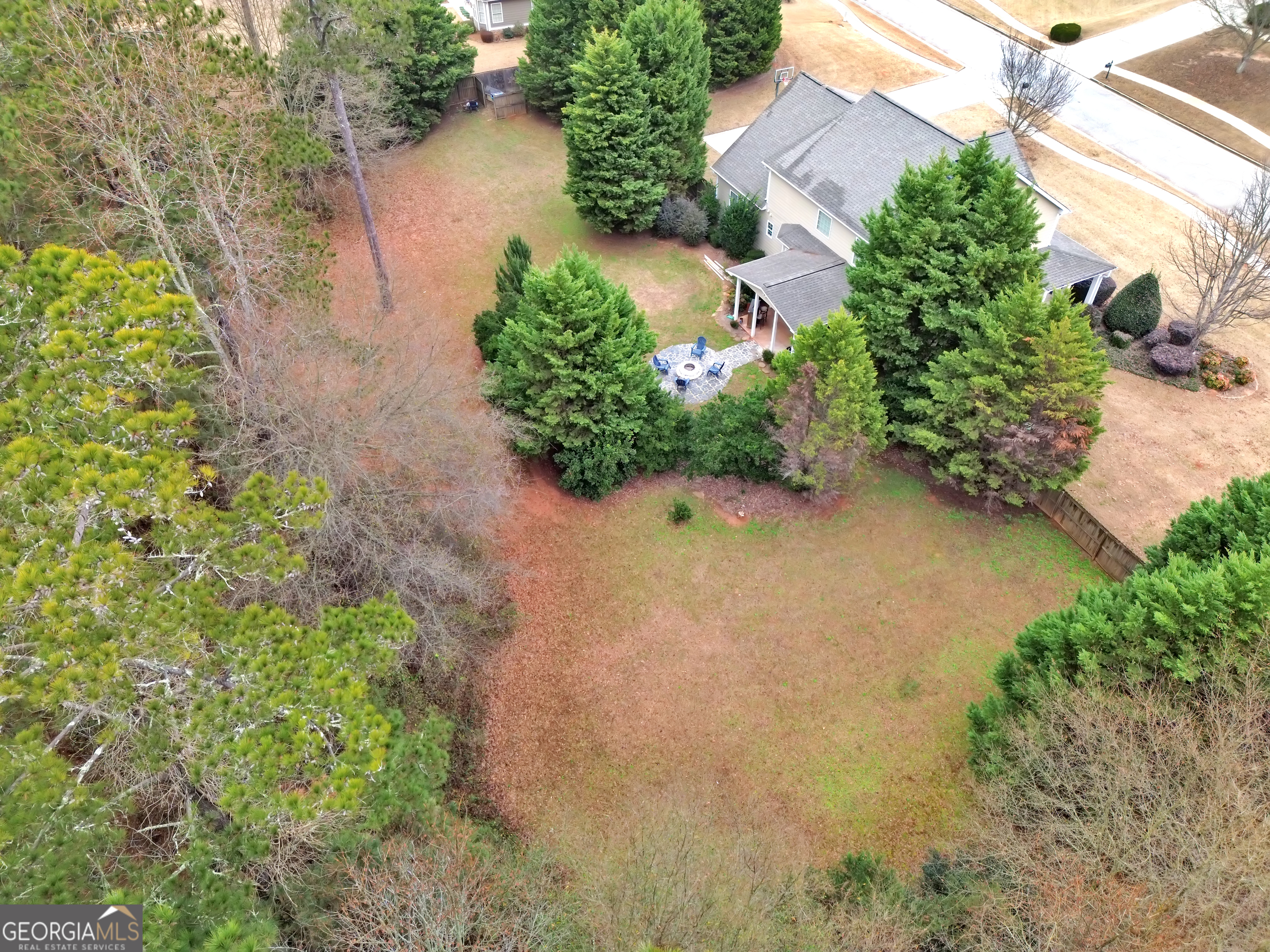 111 Caraway Road Locust Grove, GA 30248 - Photo 9 of 52 an aerial view of a house with a yard and a garden