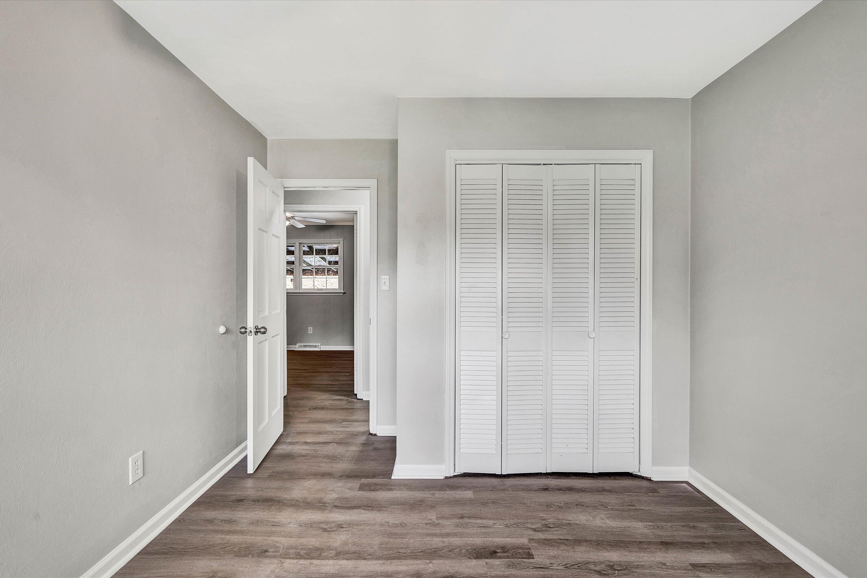 355 Pin Oak Drive Blue Ridge, VA 24064 - Photo 12 of 33 an empty room with wooden floor and entrance