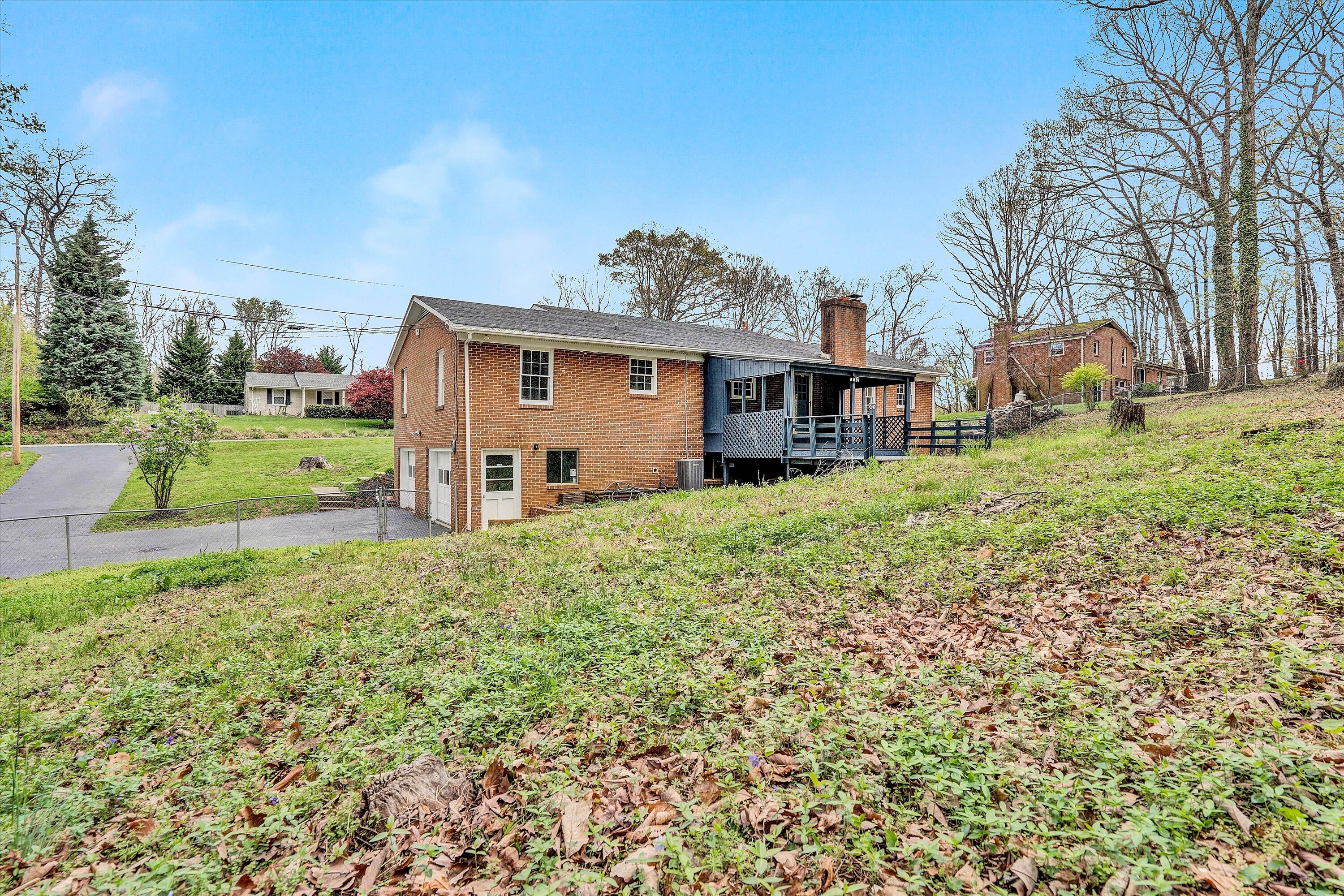 355 Pin Oak Drive Blue Ridge, VA 24064 - Photo 29 of 33 a view of a house with a yard and large tree
