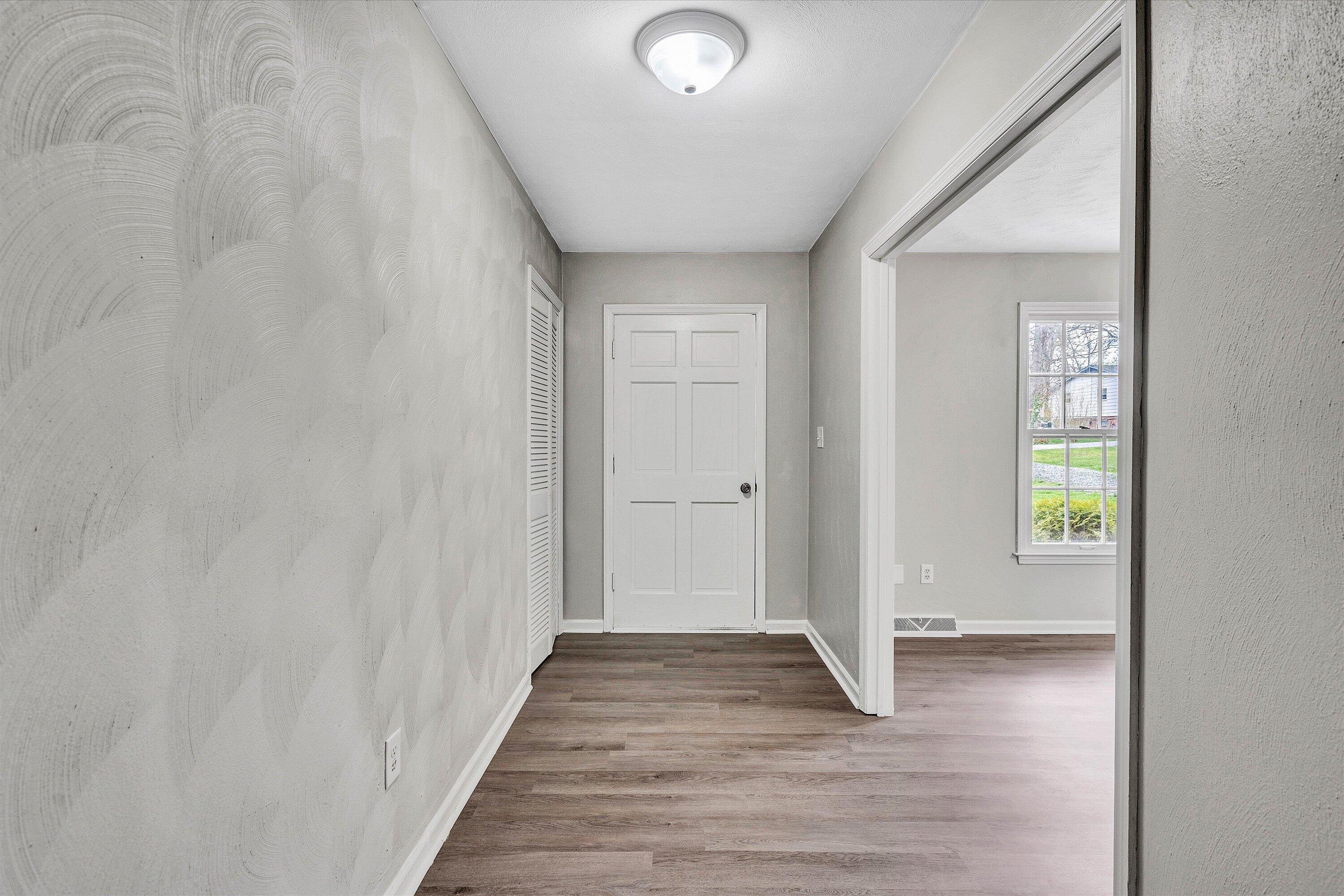 355 Pin Oak Drive Blue Ridge, VA 24064 - Photo 3 of 33 a view of a hallway with wooden floor