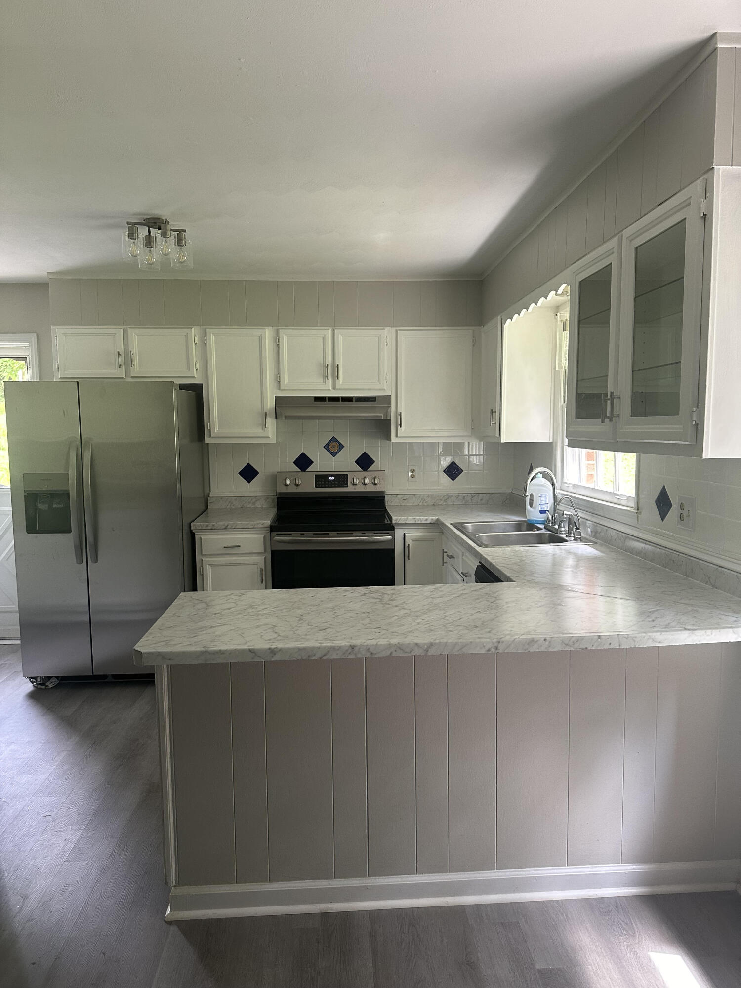 355 Pin Oak Drive Blue Ridge, VA 24064 - Photo 32 of 33 a kitchen with stainless steel appliances granite countertop a sink a stove and a refrigerator