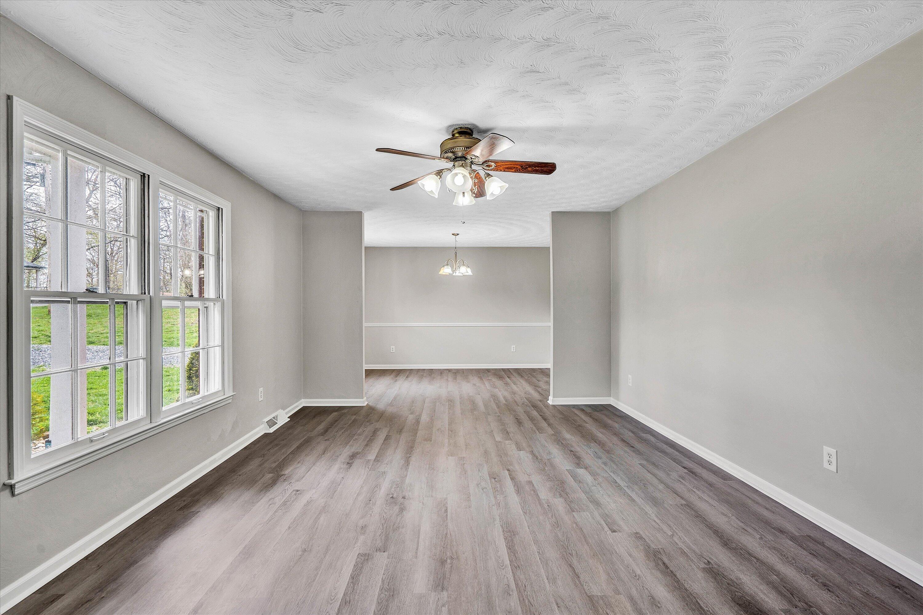 355 Pin Oak Drive Blue Ridge, VA 24064 - Photo 4 of 33 wooden floor in an empty room with a window