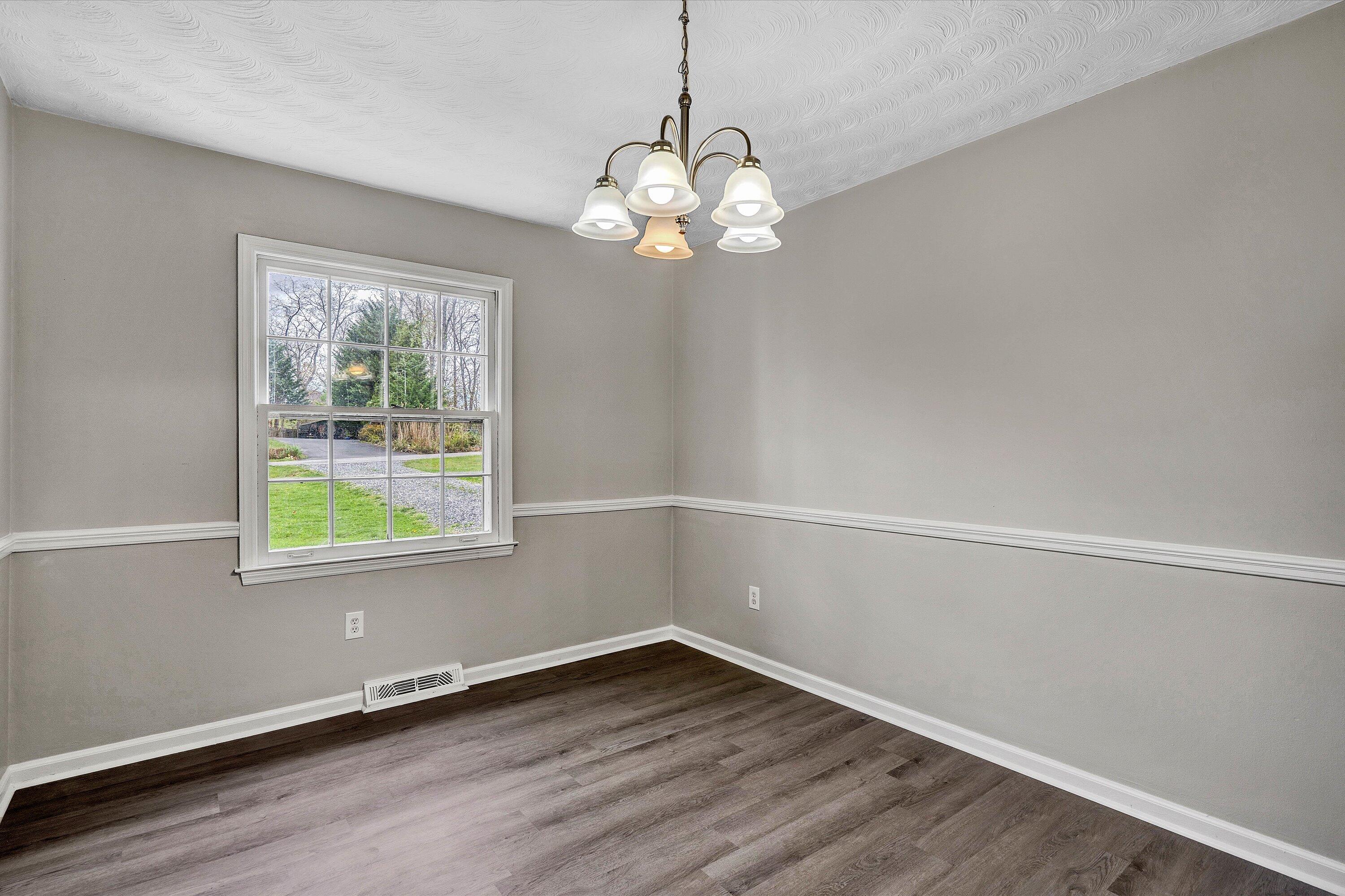 355 Pin Oak Drive Blue Ridge, VA 24064 - Photo 6 of 33 a view of a room with wooden floor and windows