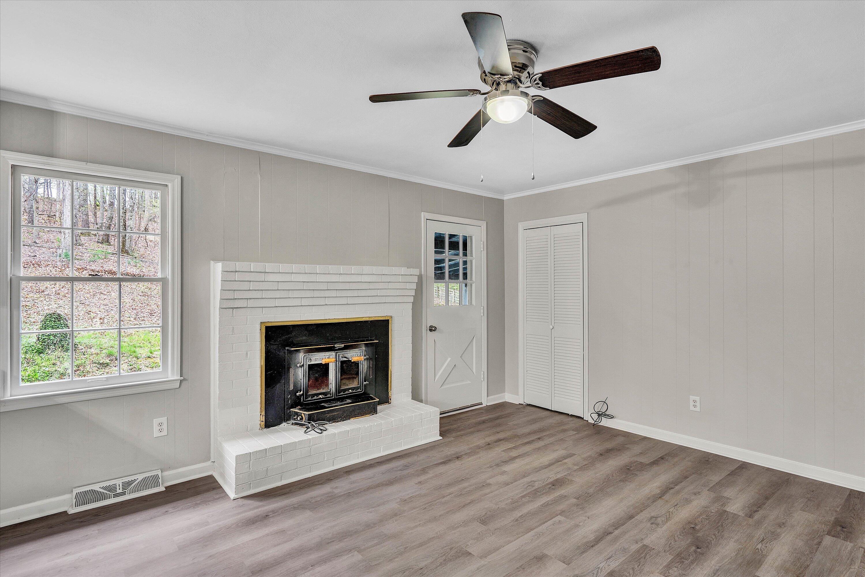 355 Pin Oak Drive Blue Ridge, VA 24064 - Photo 8 of 33 a living room with furniture and a fireplace