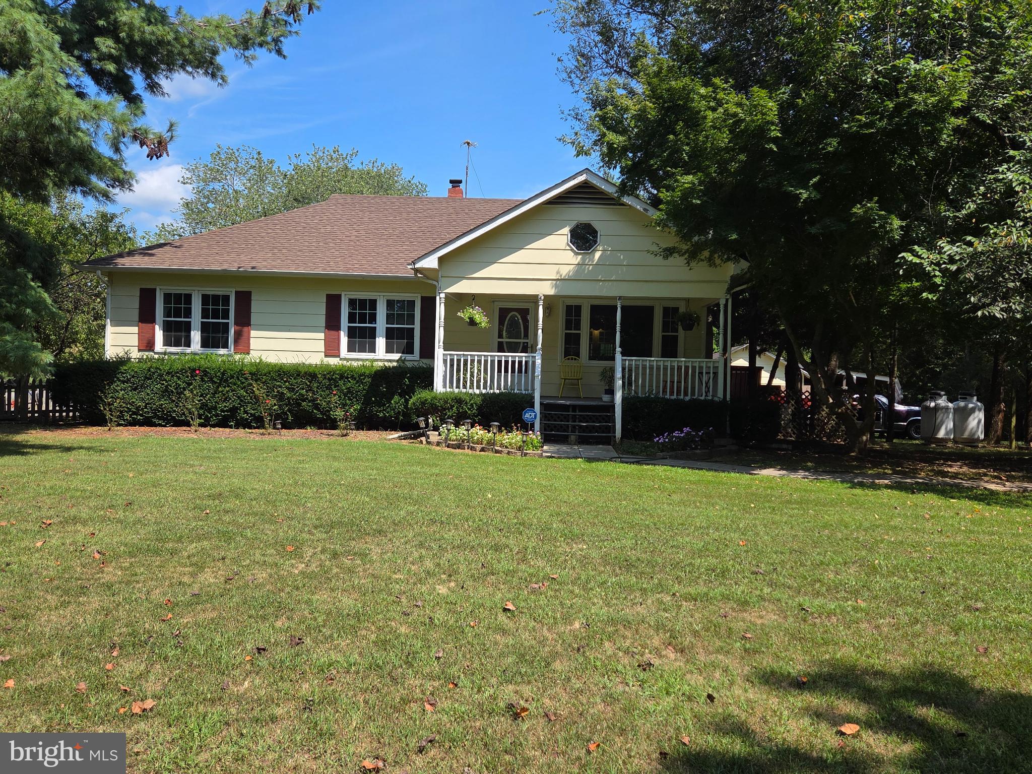 9337 Everona Road Unionville, VA 22567 - Photo 1 of 1 a front view of a house with a garden