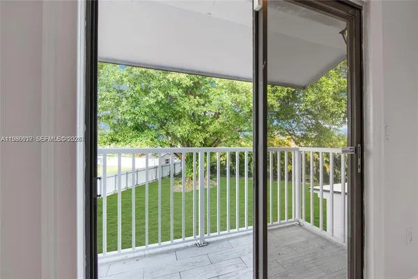 a view of a porch with a floor to ceiling window