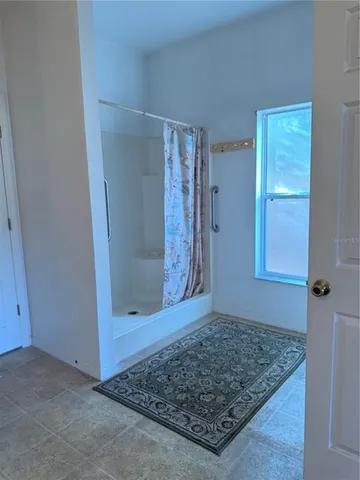 a view of backyard with large trees