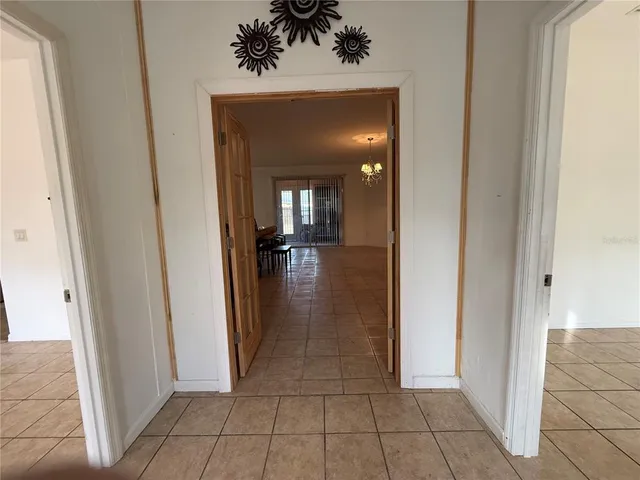 a view of a closet area with living room