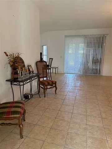 a view of a livingroom with furniture and a chandelier