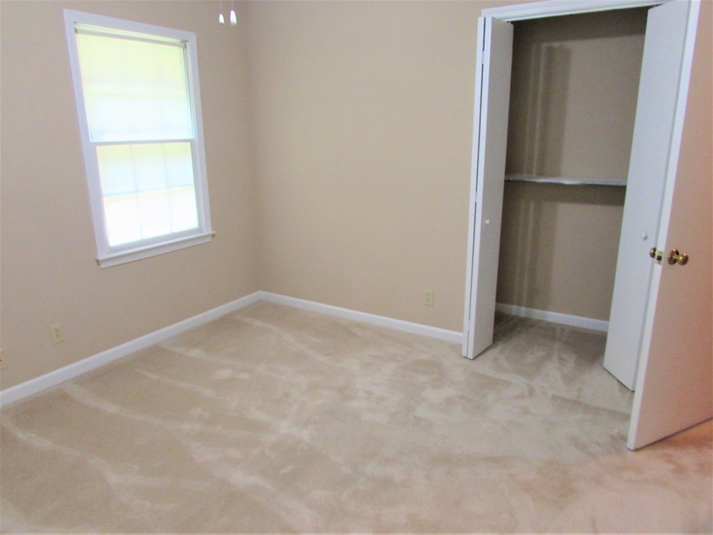 3847 Hartley Bridge Road Macon, GA 31216 - Photo 13 of 26 an empty room with a window
