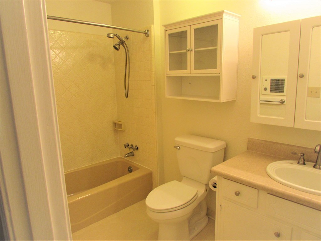 3847 Hartley Bridge Road Macon, GA 31216 - Photo 16 of 26 a bathroom with a sink a toilet and shower