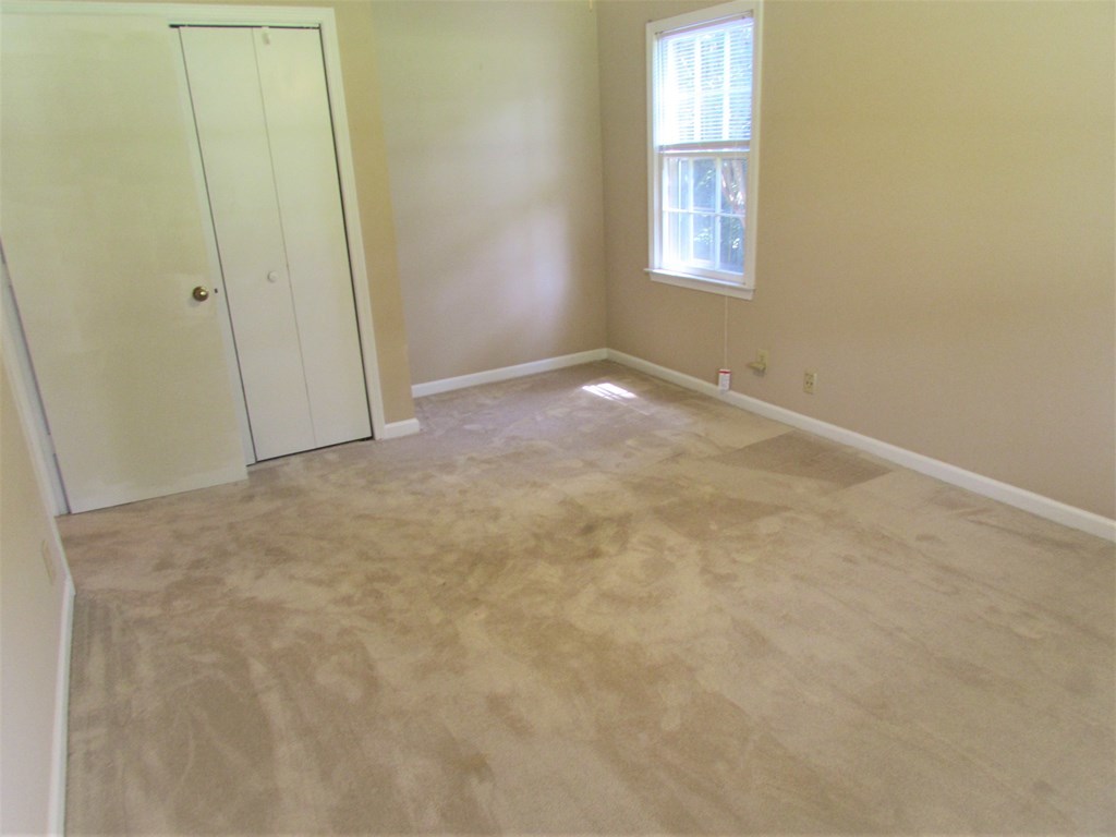 3847 Hartley Bridge Road Macon, GA 31216 - Photo 17 of 26 an empty room with windows
