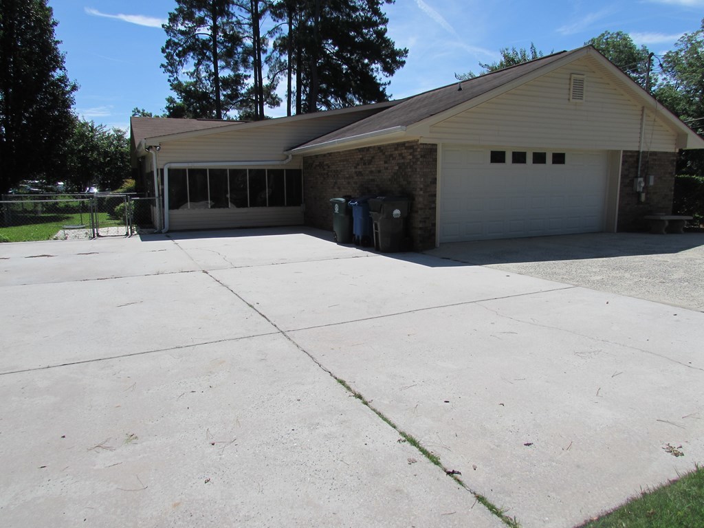 3847 Hartley Bridge Road Macon, GA 31216 - Photo 3 of 26 a view of house with backyard and tree
