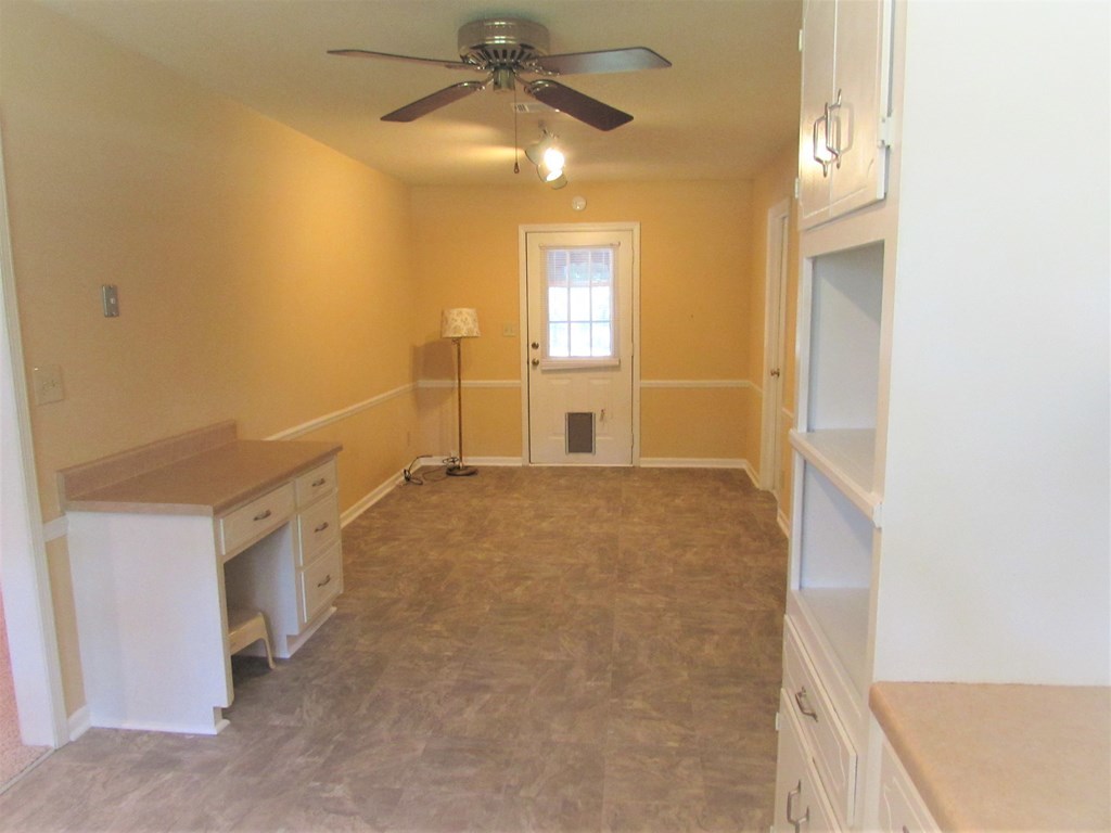 3847 Hartley Bridge Road Macon, GA 31216 - Photo 21 of 26 a view of an empty room with window and chandelier fan