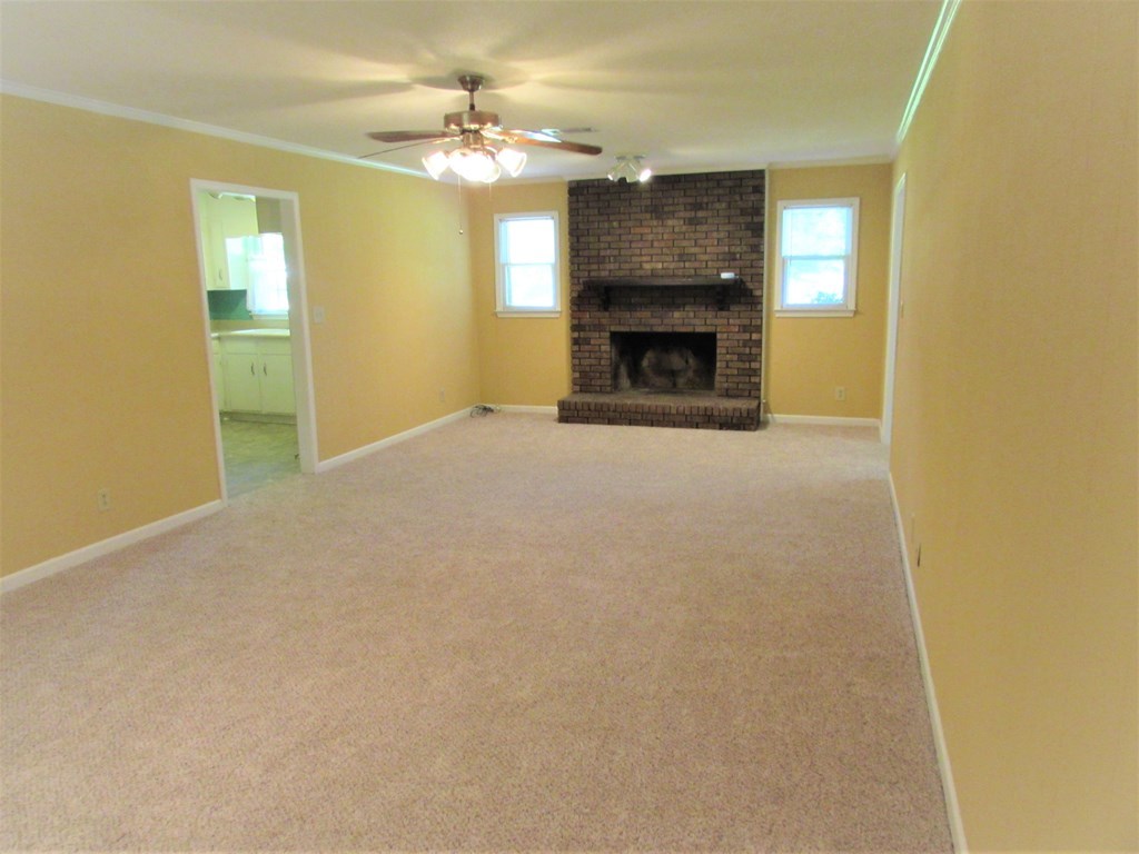 3847 Hartley Bridge Road Macon, GA 31216 - Photo 23 of 26 a view of empty room with a fireplace