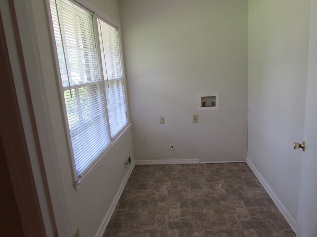 3847 Hartley Bridge Road Macon, GA 31216 - Photo 24 of 26 an empty room with windows