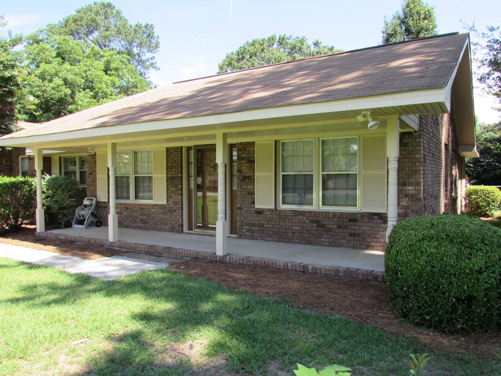 3847 Hartley Bridge Road Macon, GA 31216 - Photo 6 of 26 a view of a house with a garden