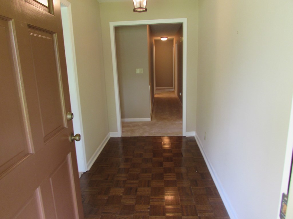 3847 Hartley Bridge Road Macon, GA 31216 - Photo 7 of 26 an entryway door with lots of wooden floor