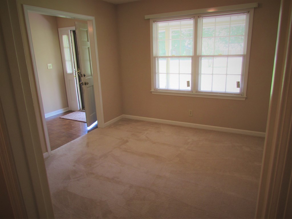 3847 Hartley Bridge Road Macon, GA 31216 - Photo 8 of 26 an empty room with windows