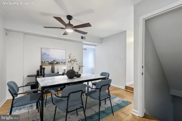 a dining room with furniture and window