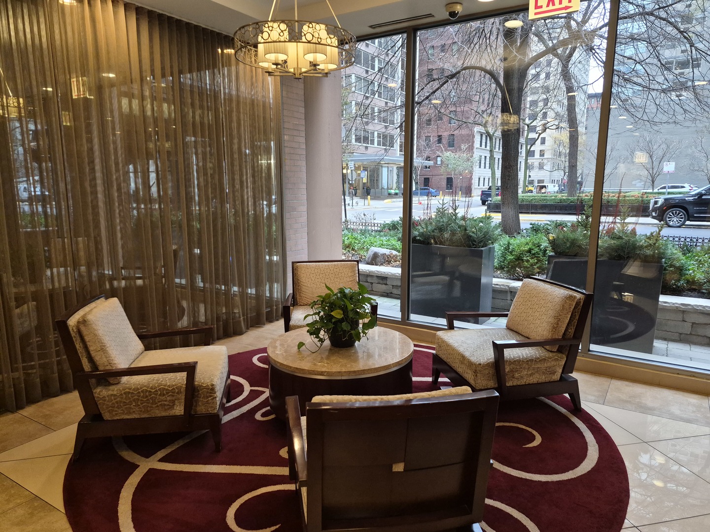 247 East Chestnut Street, Unit 1204 Chicago, IL 60611 - Photo 16 of 16 a view of a patio with a dining table and chairs