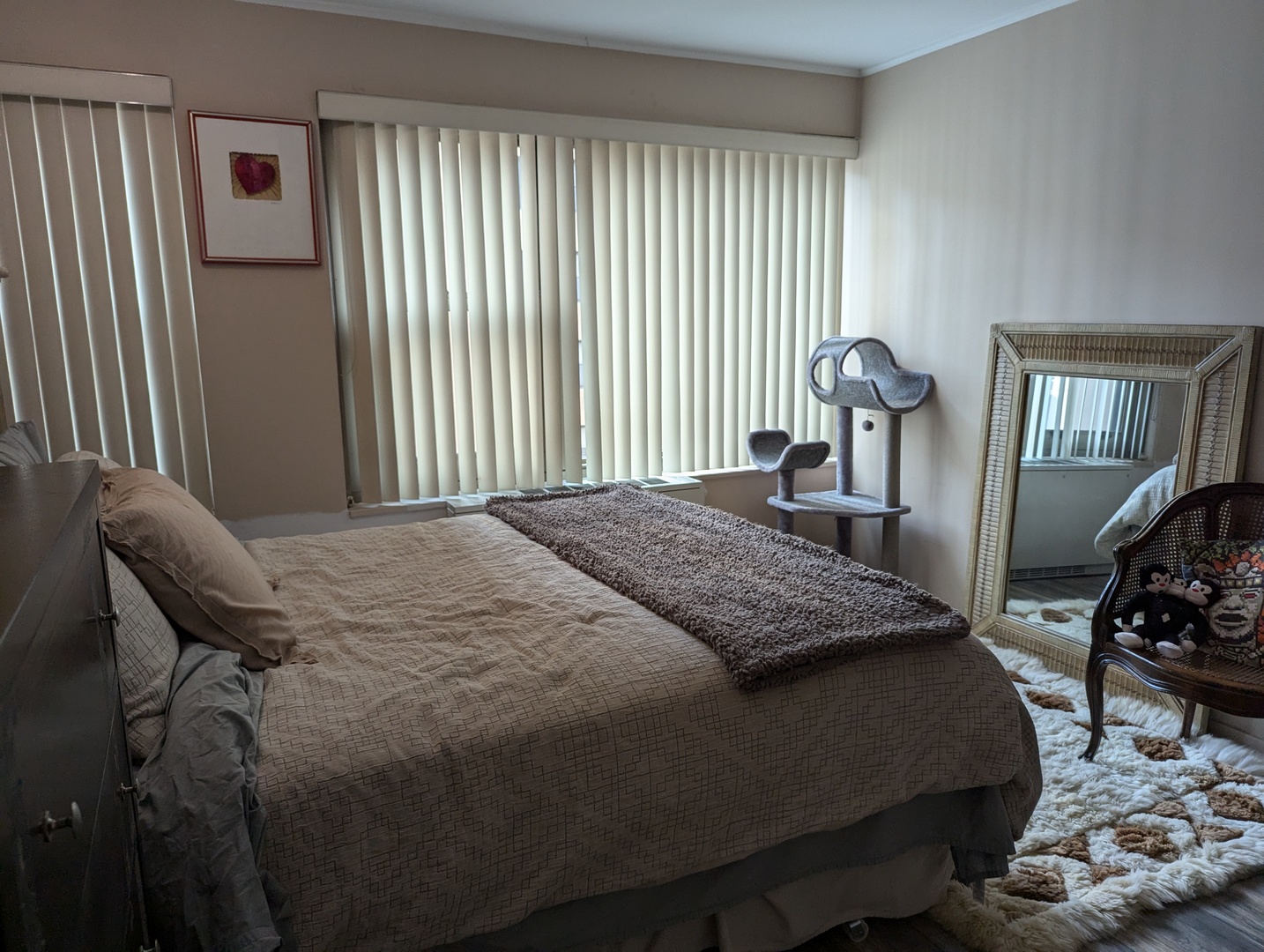 247 East Chestnut Street, Unit 1204 Chicago, IL 60611 - Photo 8 of 16 a bedroom with a bed and wooden floor